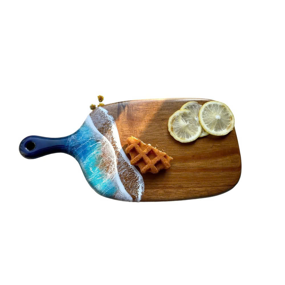 Acacia wood resin cutting board close-up of ocean resin grain detail