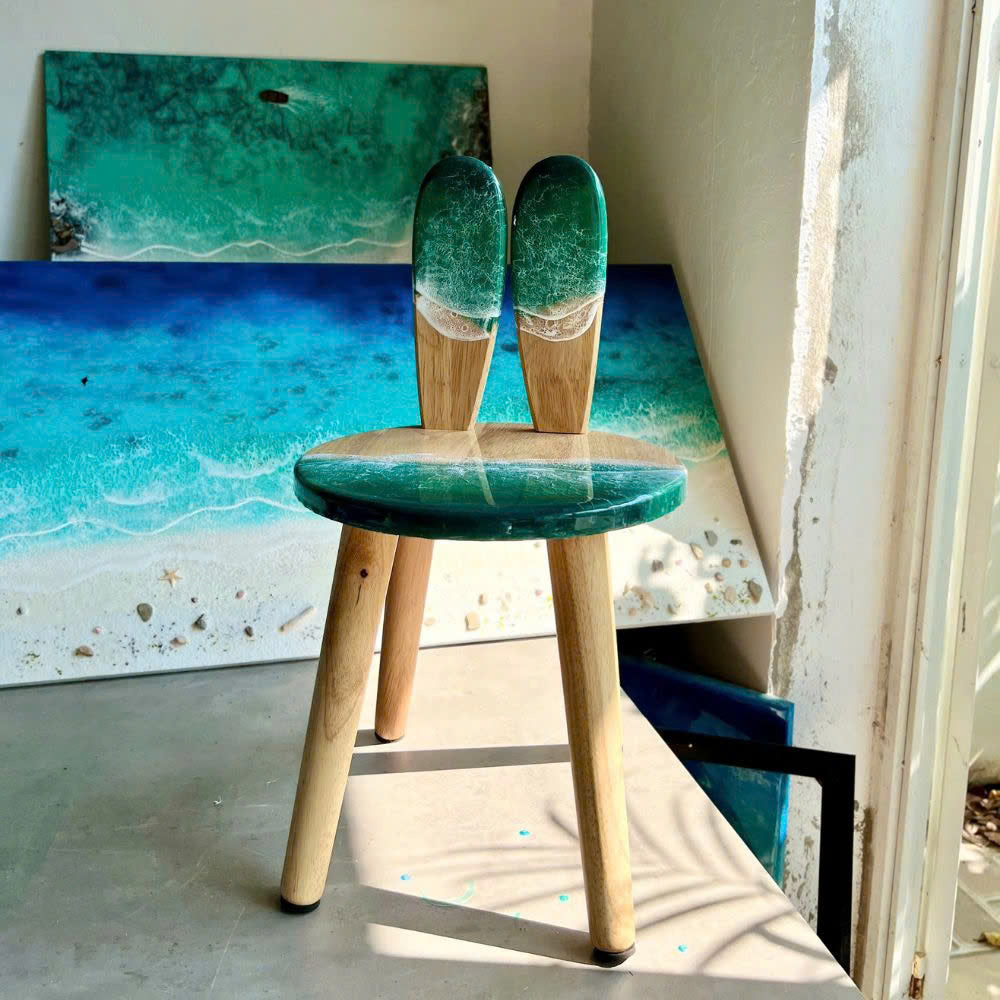 Turquoise resin kids chair styled in a child's room setting
