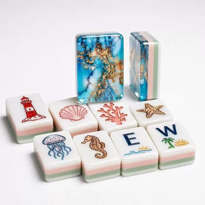 Ocean theme mahjong tiles with lighthouse, seashell, coral, starfish, jellyfish and seahorse icons